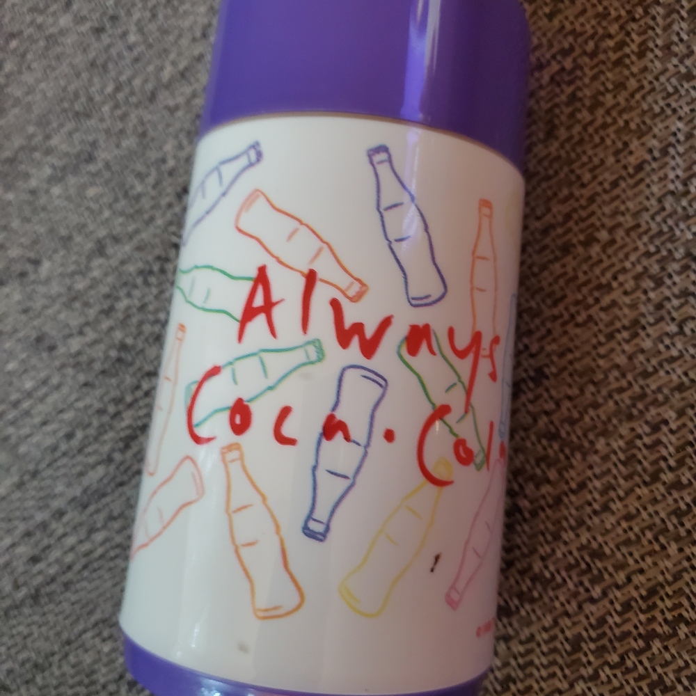 Coca-Cola Bottle with Purple and Multicolor Design